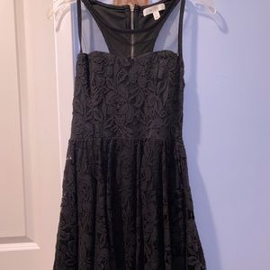 Black lace dress with mesh covering the chest